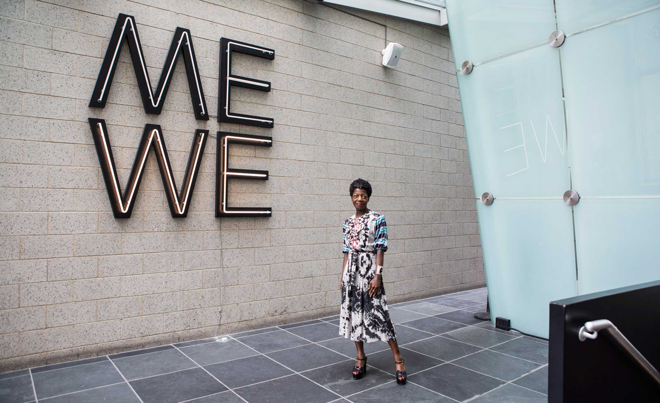 Thelma Golden with Glenn Ligon’s Give us a Poem (Palindrome #2) at the Studio Museum in Harlem