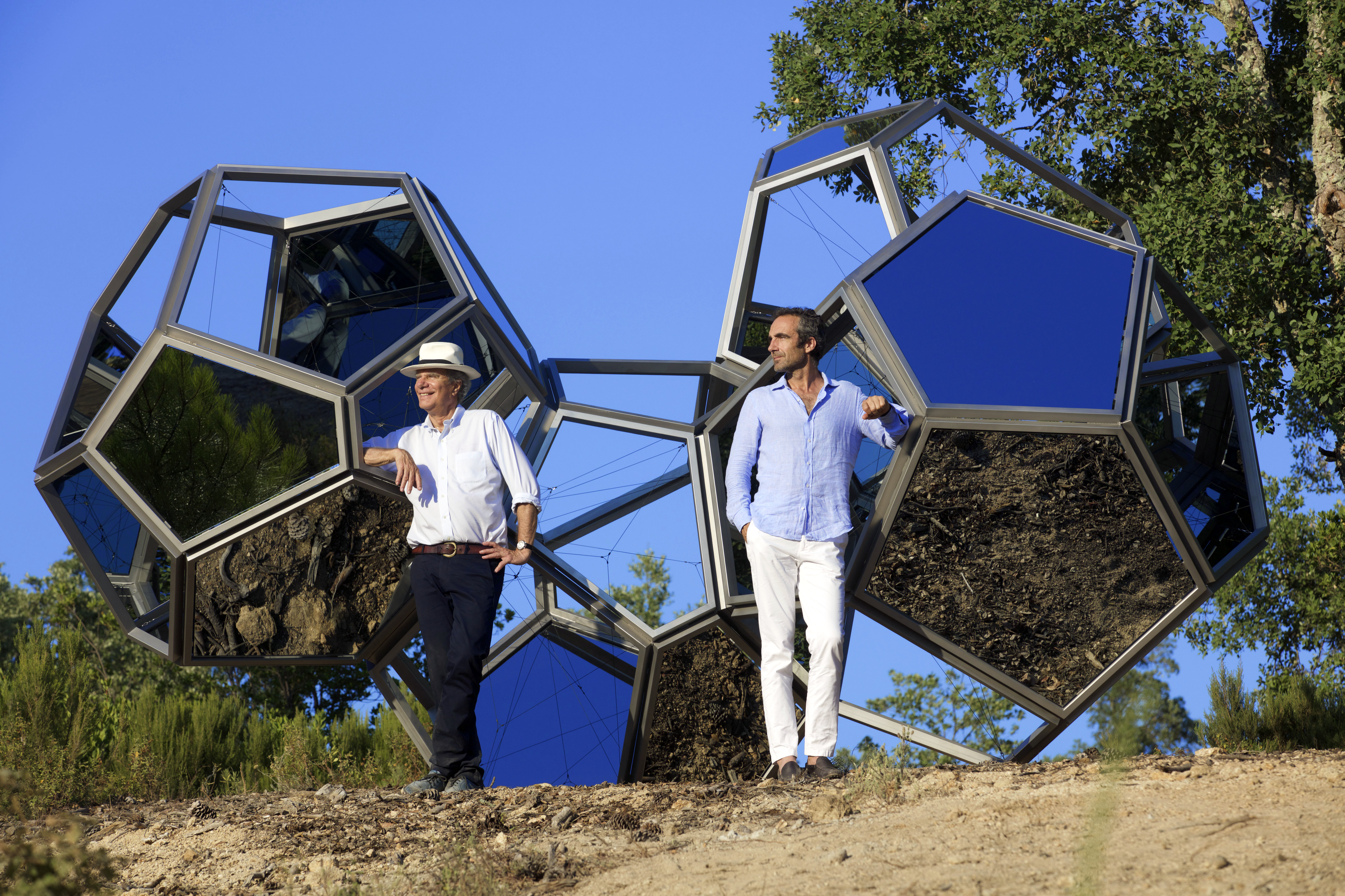 Jean-Gabriel and Edward Mitterrand with Tomás Saraceno’s <em>Air-Port-City/Cloud Cities 4 Modules Metal</em>, 2010.