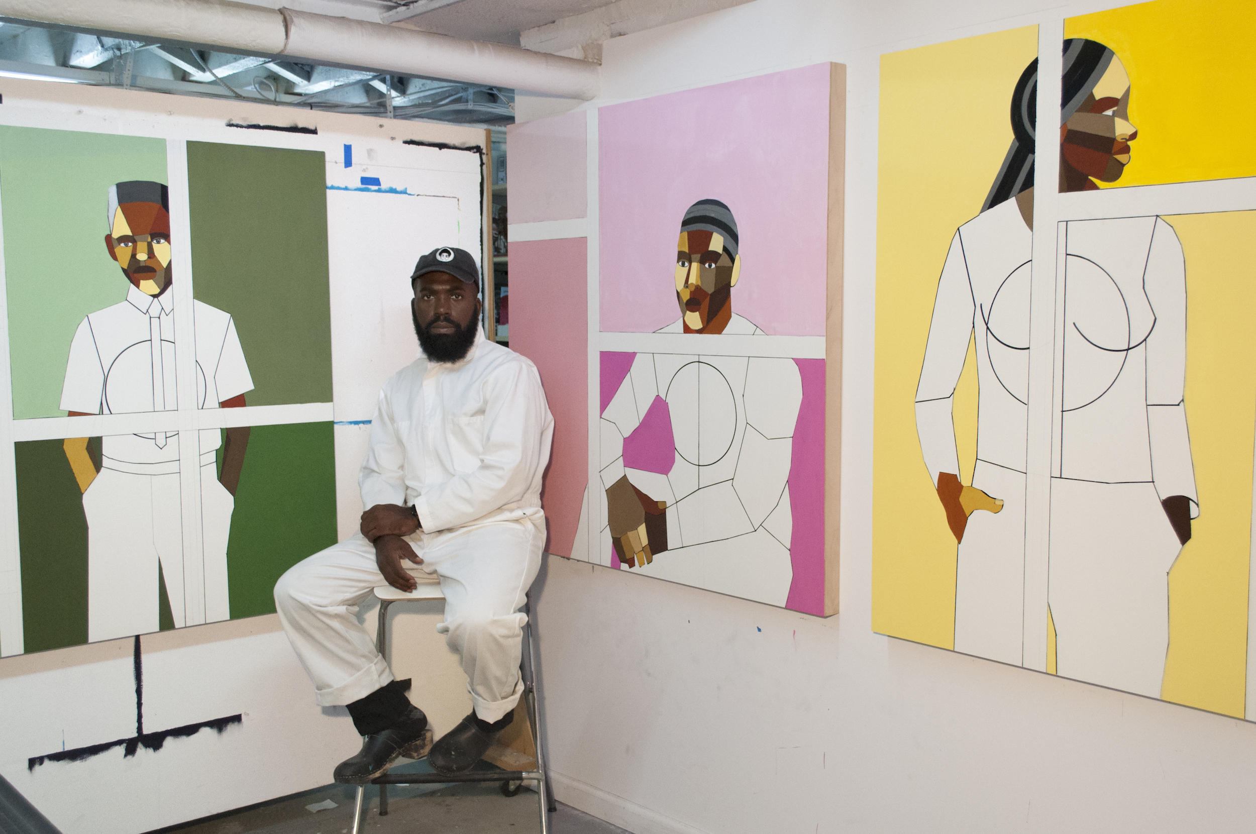Derrick Adams in his studio in Brooklyn alongside works in progress for “Repose,” his solo show at UTA Artist Space opening October 28. Portrait by Devin N. Morris. 