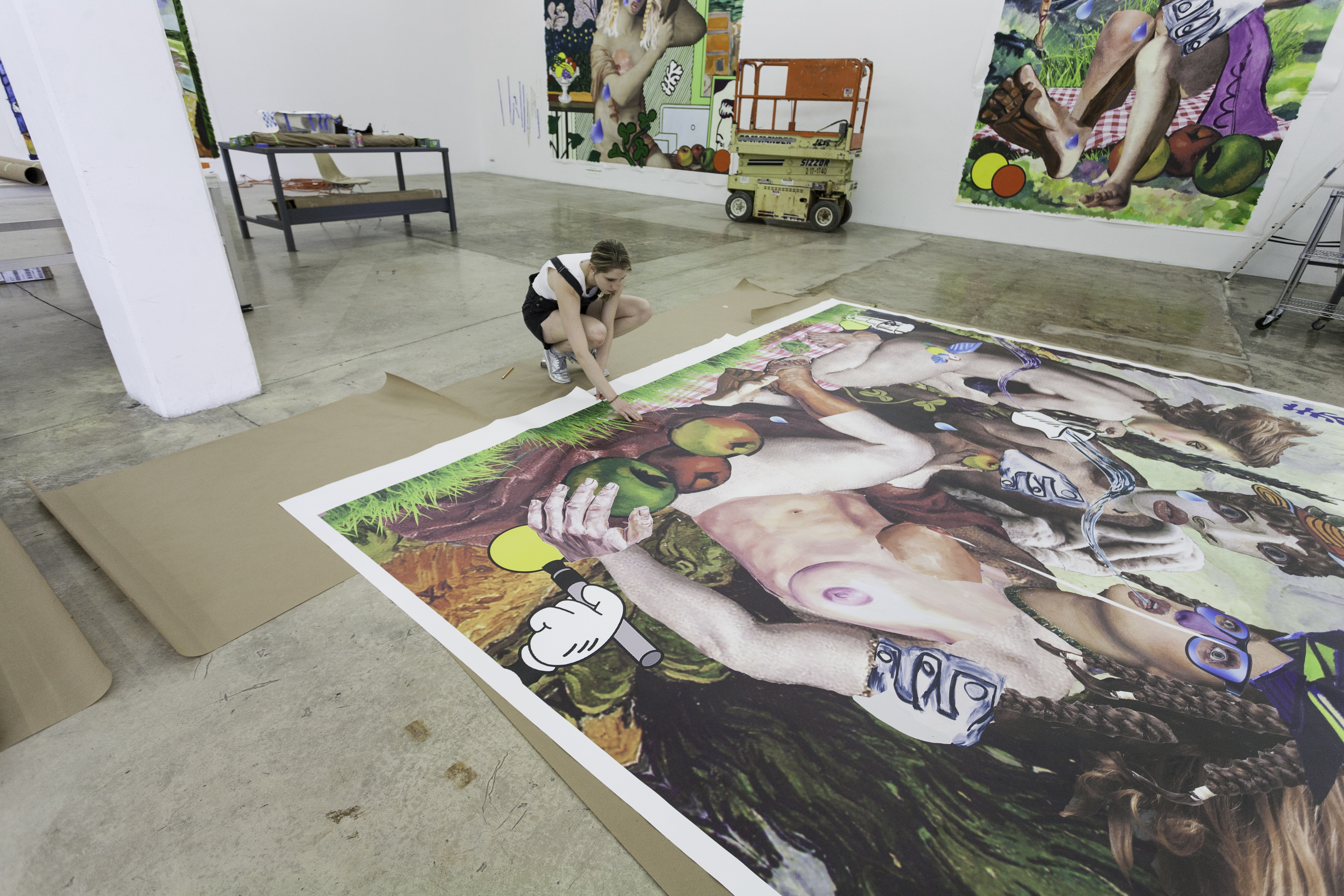 Allison Zuckerman in front of a work in progress, Creation in the Earthly Garden, at the Rubell Family Collection.