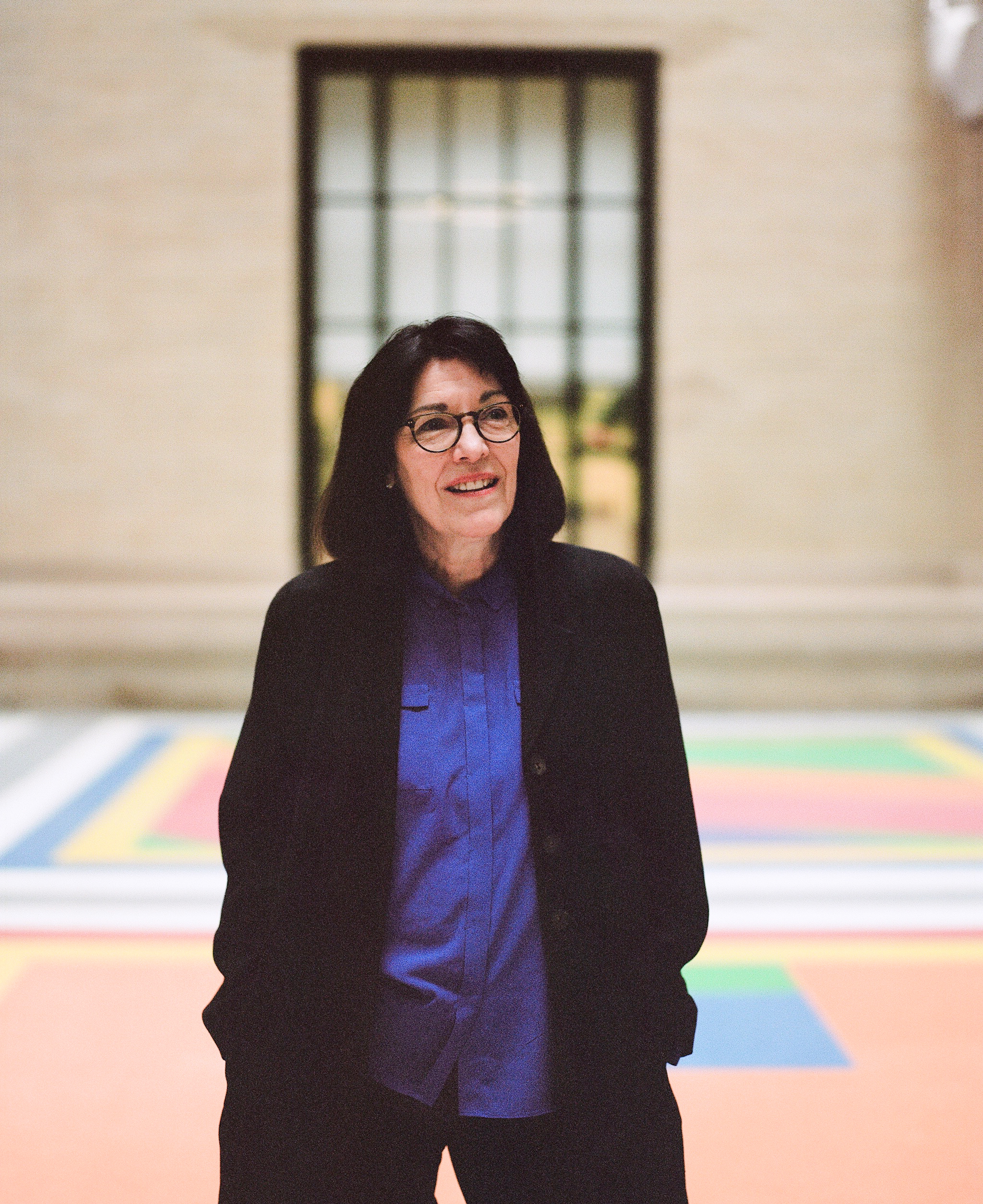 Leila Kinney, executive director of MIT’s Center for Art, Science and Technology (CAST), in front of Sol LeWitt’s Bars of Color within Squares (MIT), 2007, designed for the university’s physics department