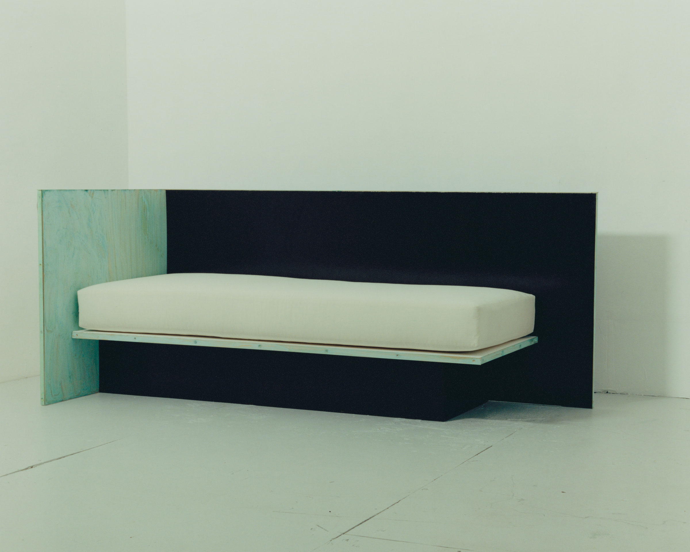 Brass & lacquered wood daybed, 2018. Plywood, lacquer, patinated brass and upholstered mattress.