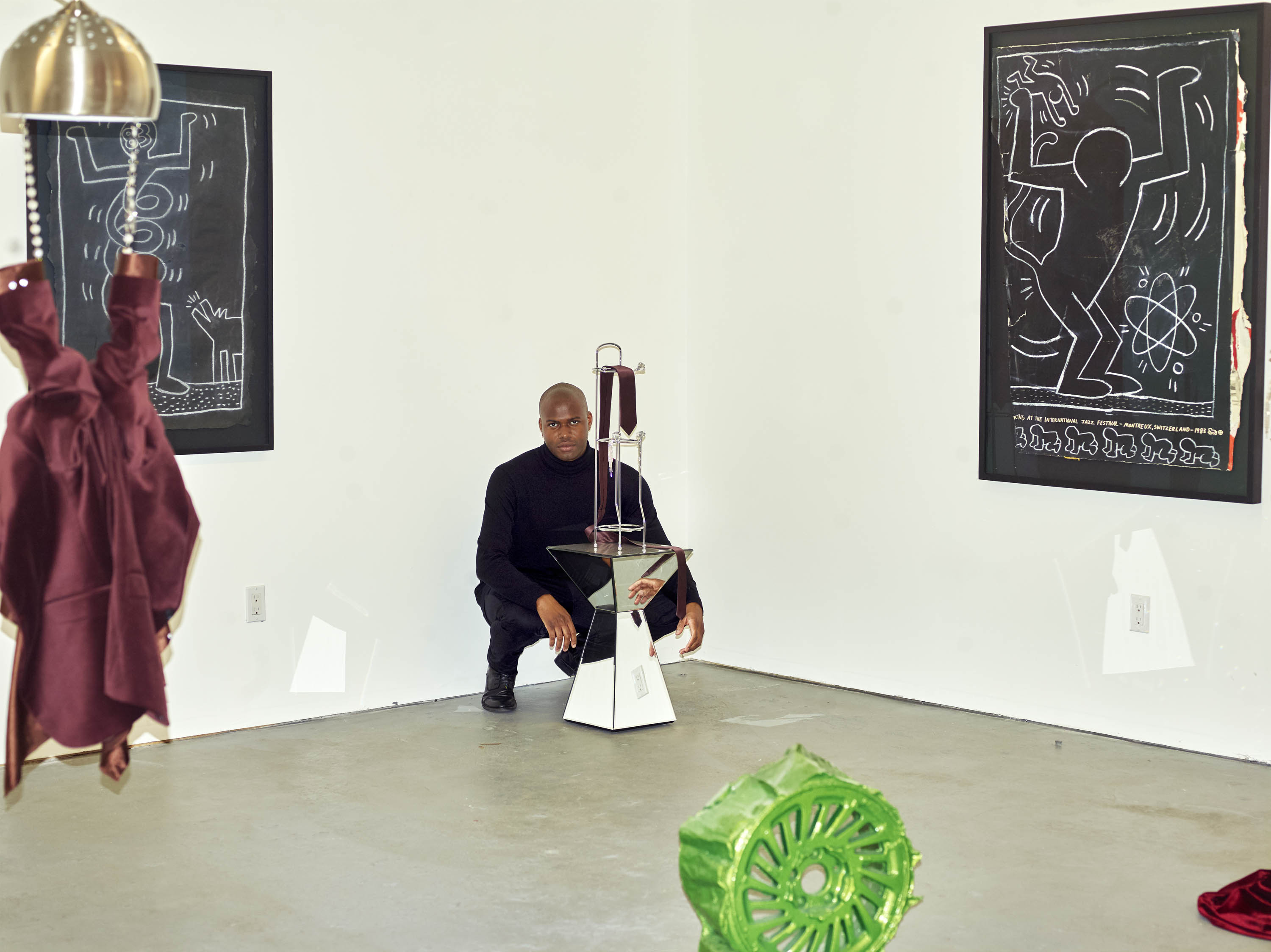 Kayode Ojo captured at Martos gallery installing his solo show. JPW3 sculpture in foreground.