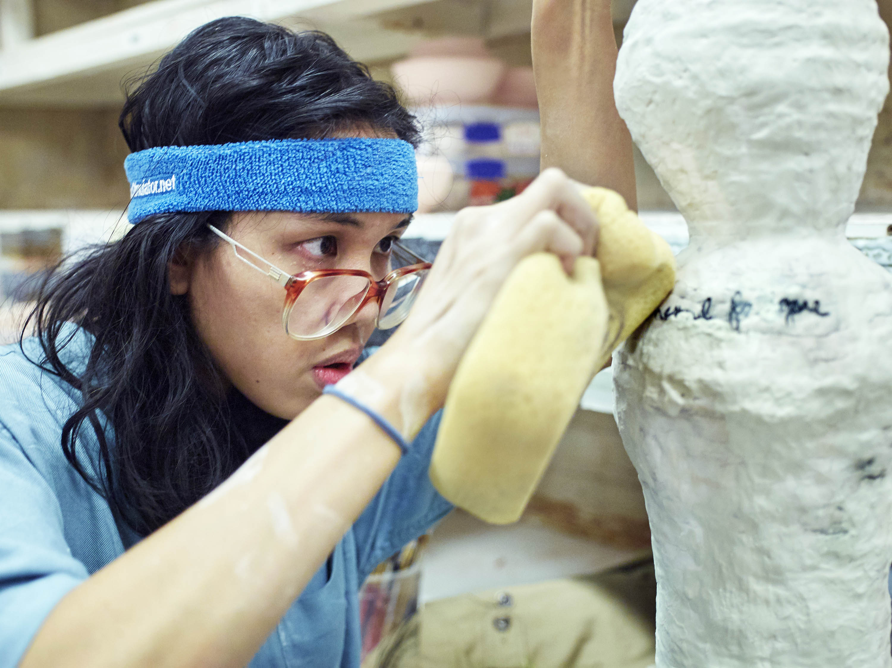 Trisha Baga works on a vase at the Greenwich House Pottery for a friend, 2018. 