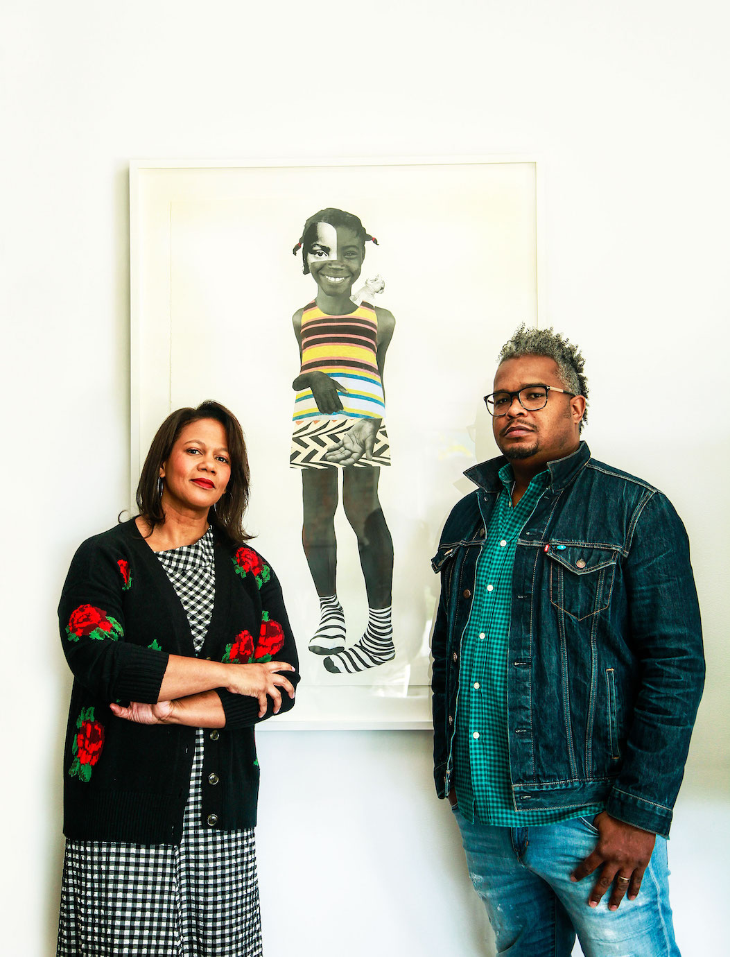 Tina Perry-Whitney and Ric Whitney in their Hollywood Hills home with painter Deborah Roberts' piece, Bare feet girls grow up mean (2017)