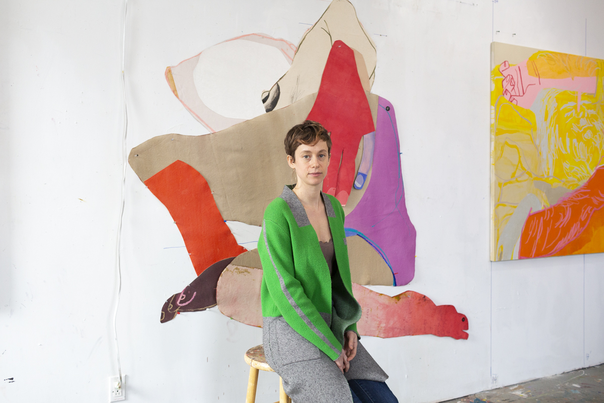 Sarah Faux with an in-progress cut-out collage that will debut at Frieze New York this May. Portrait by Isabel Magowan.