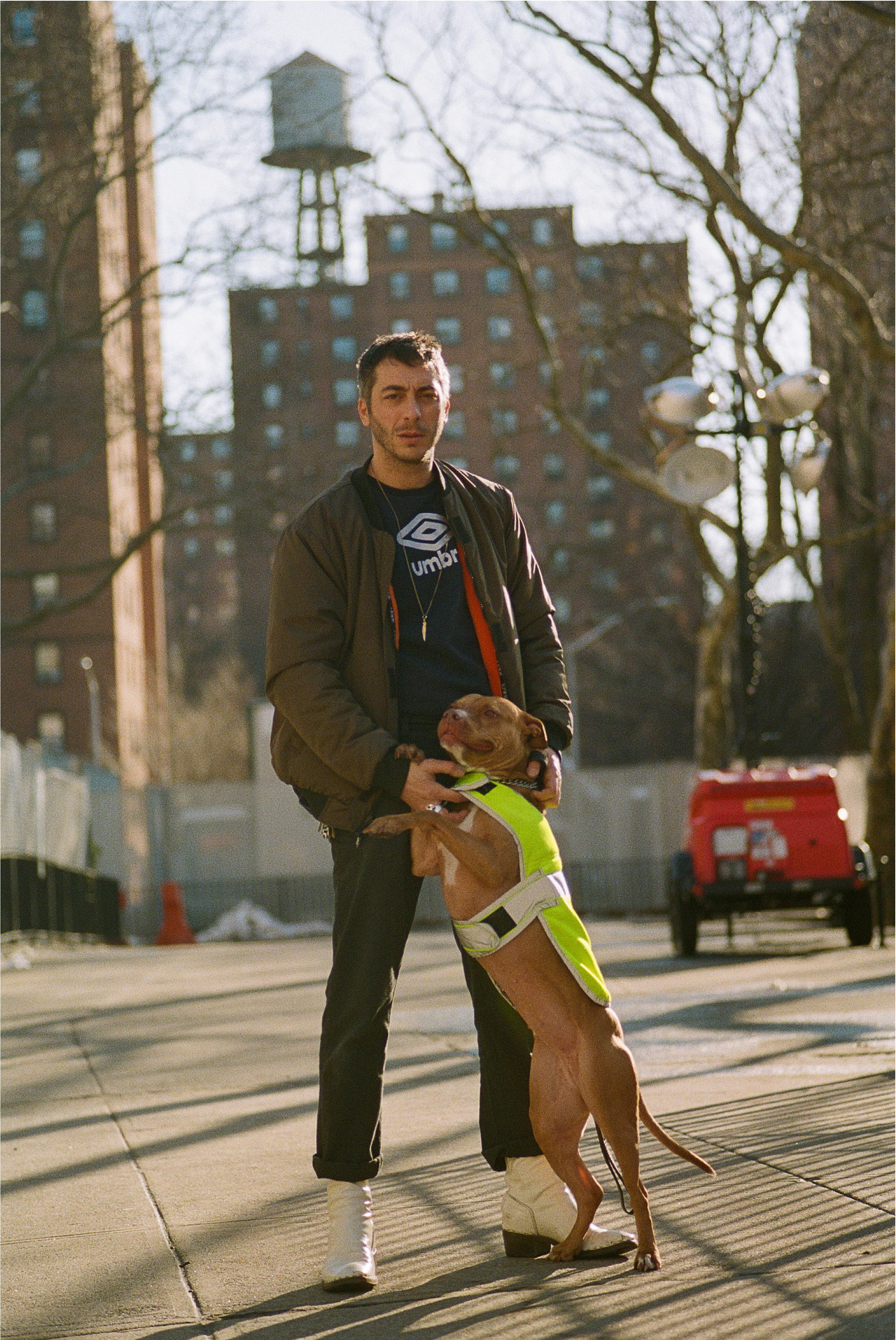 Designer Alessandro Simonetti and Cleo, the dog, find their place in Alphabet City. Simonetti wears U.P.W.W.’s reversible bomber from FW18, an Umbro sweatshirt, Ben Davis pants, and custom boots from Premiata. Cleo rocks the Utility-Pro collar.