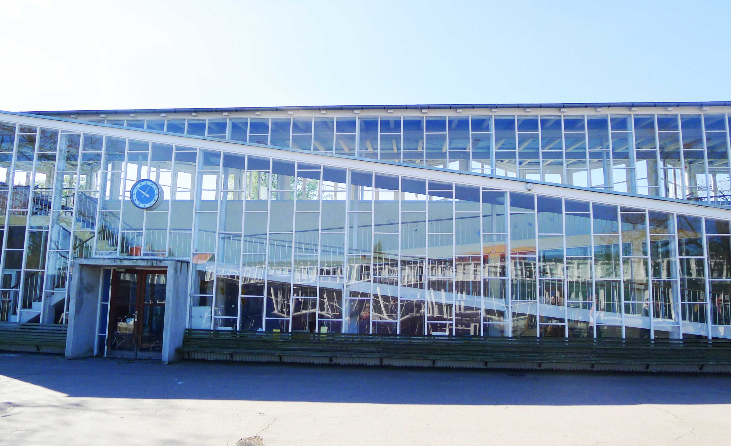 A century old glass-enclosed handicapped ramp for children stands exactly as it was designed, and is still in use. Beyond merely accommodating, it is an expression of pride and dignity for children with disabilities. 