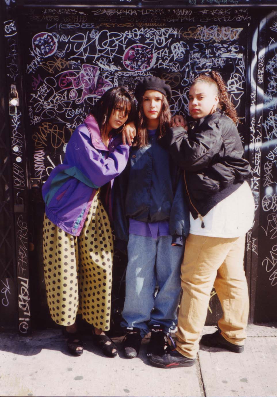 Three young women in front of Patterson’s door at 161 Essex Street, 1992. Photograph by Clayton Patterson.