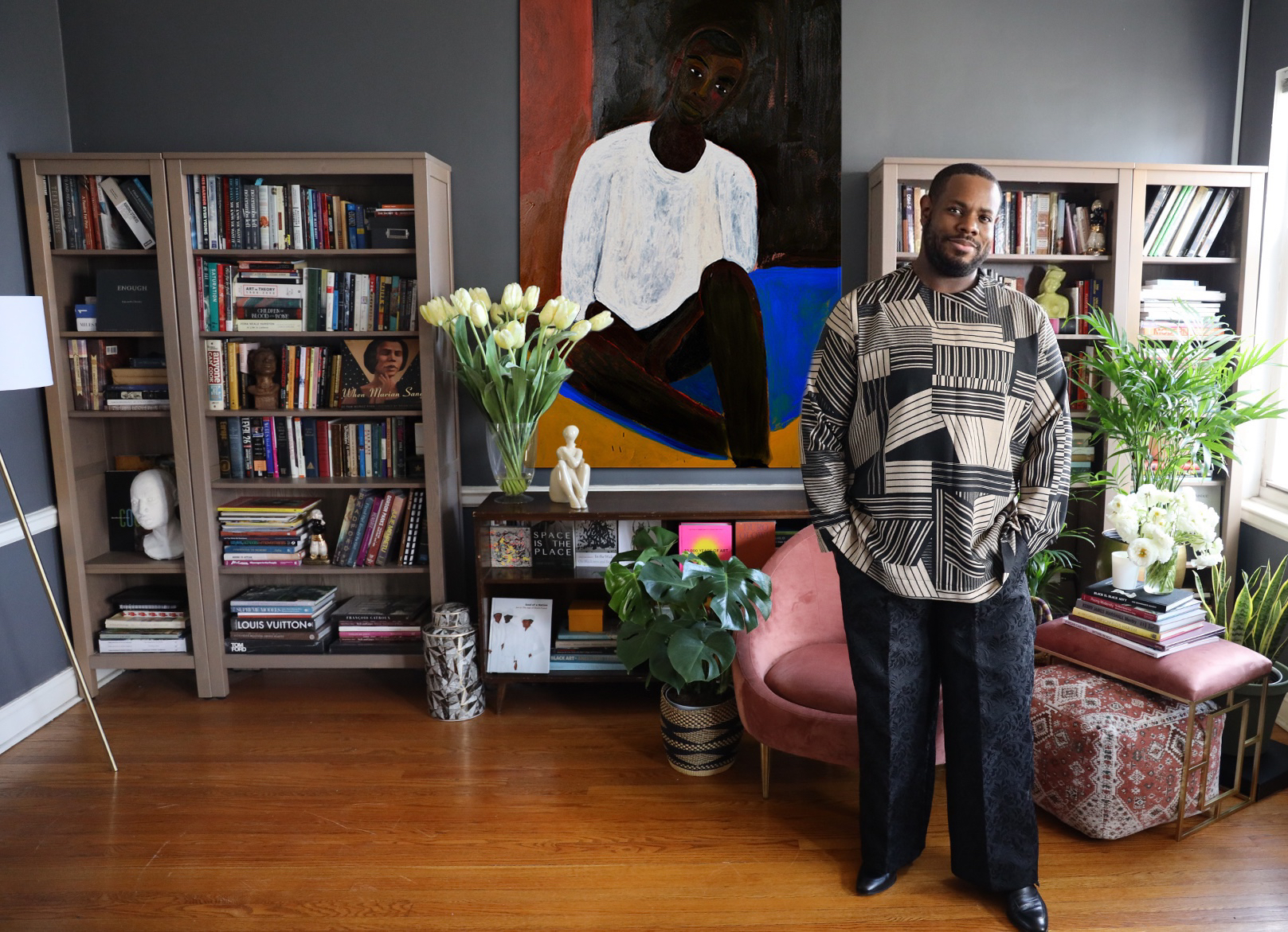 Danny Dunson in his Chicago home featuring the art of Patrick Eugene, Kept Awake, 2021. Courtesy the artist and Legacy Brothers LLC. Photography by Bailey Ellis.