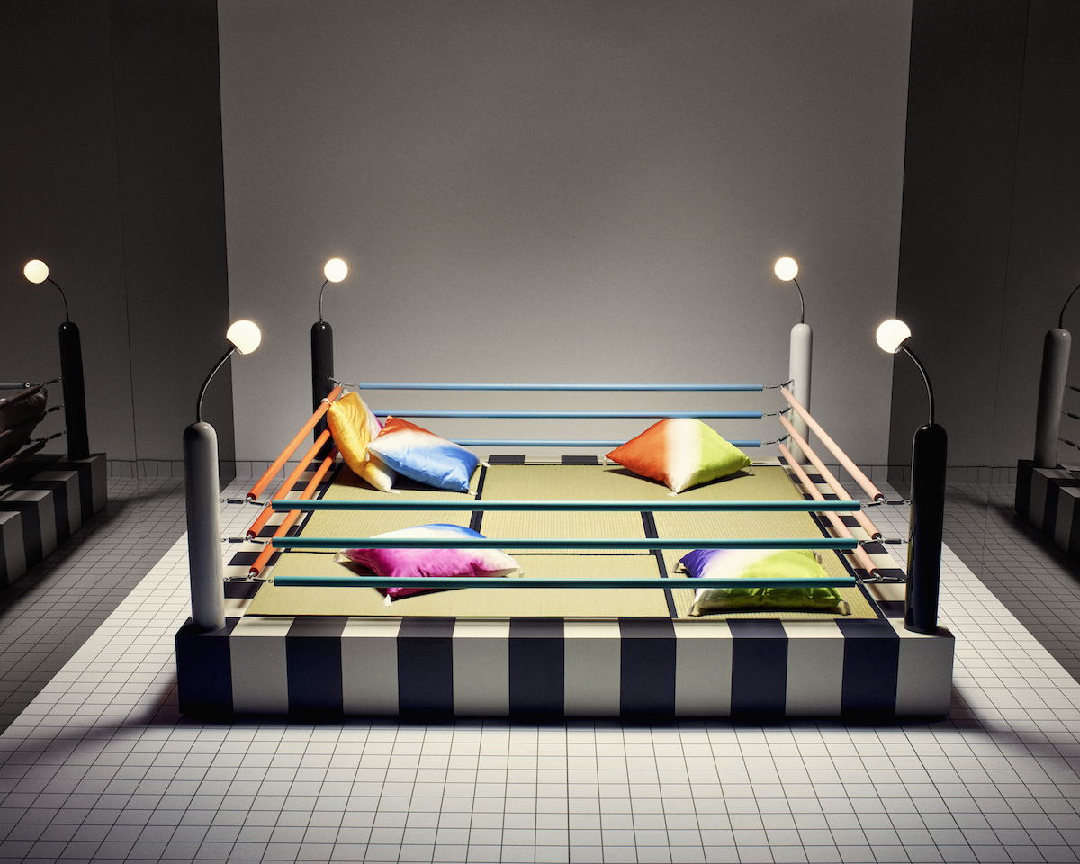 Masanori Umeda, Ring wooden boxing ring with black and white border. Floor in tatami. The furnishing is made up of five colored silk cushion and a wood tray. All photography courtesy of Saint Laurent.