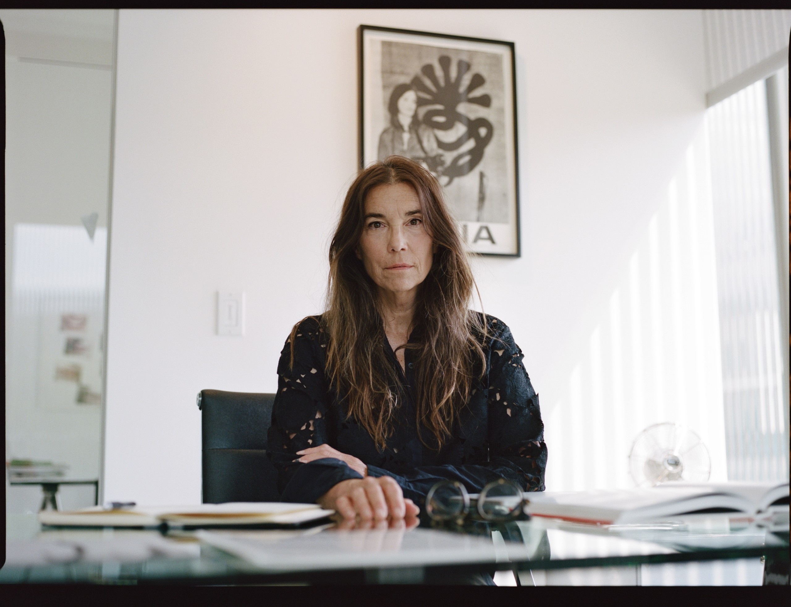 Art dealer sitting at her desk