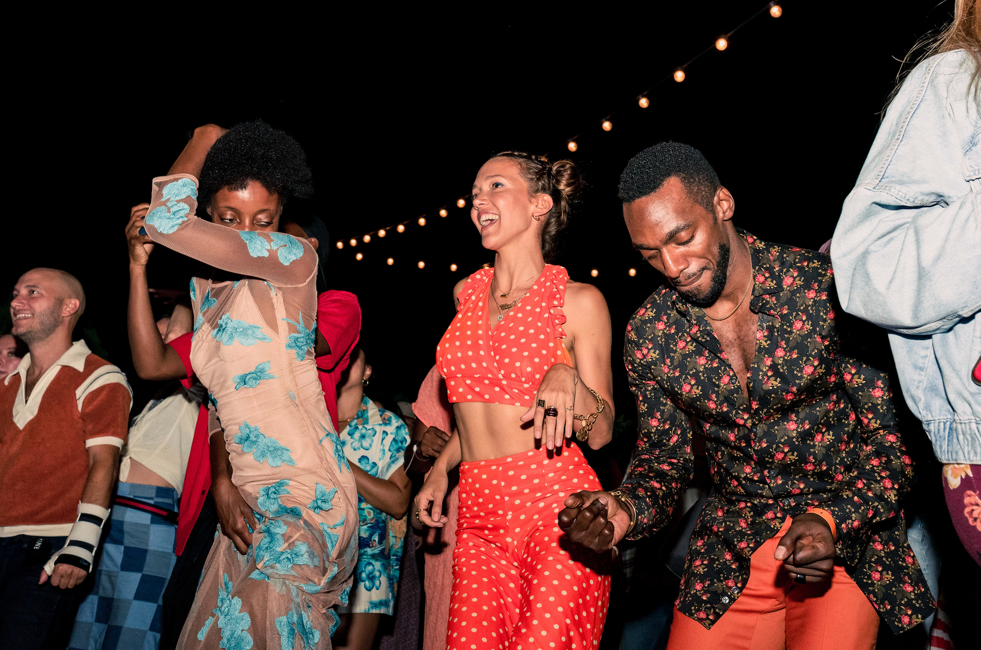 Zoë Buckman and Daniel J. Watts dance with the crowd at Lilac Jam. 