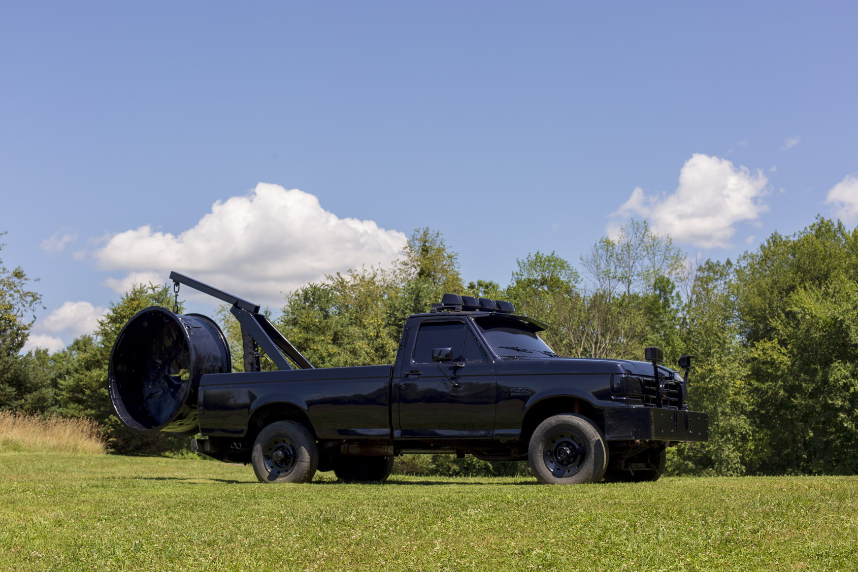 shiny black truck sculpture by virginia overton at the ranch montauk