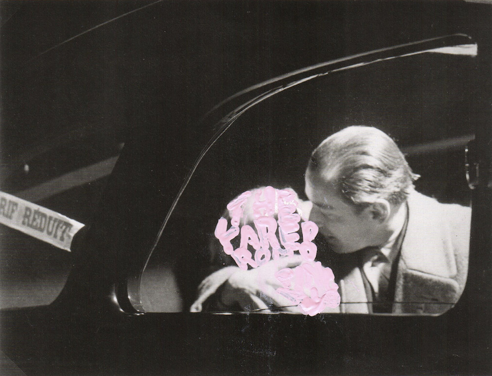 work by betty tompkins of black and white photo of man and woman kissing in a car, woman covered in light pink writing