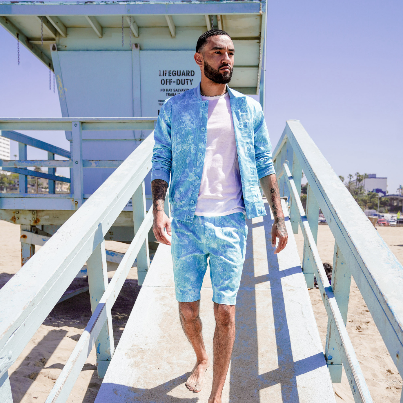 man walking from lifeguard tower