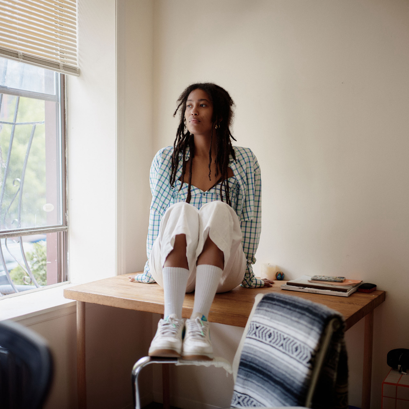 woman sitting on desk