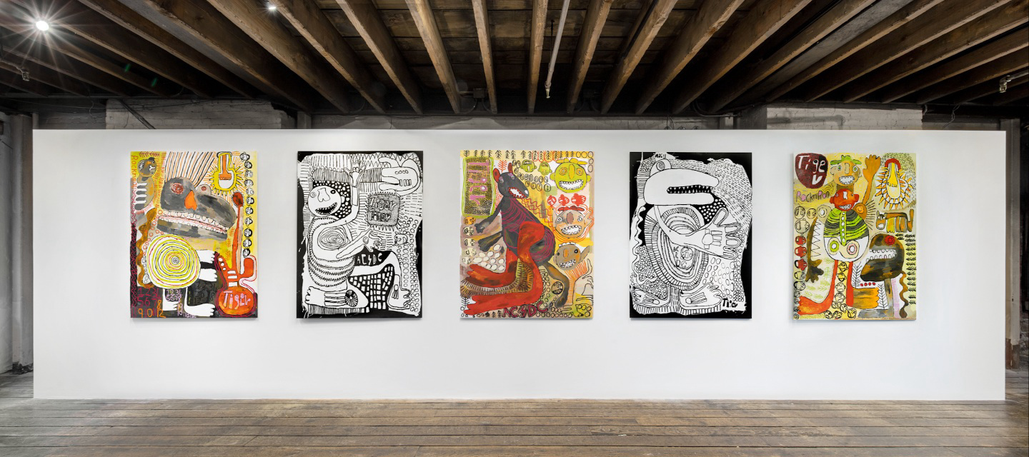 five paintings hanging in gallery space