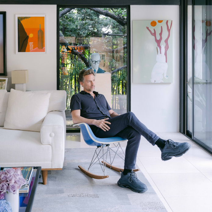 man sitting in chair in living room