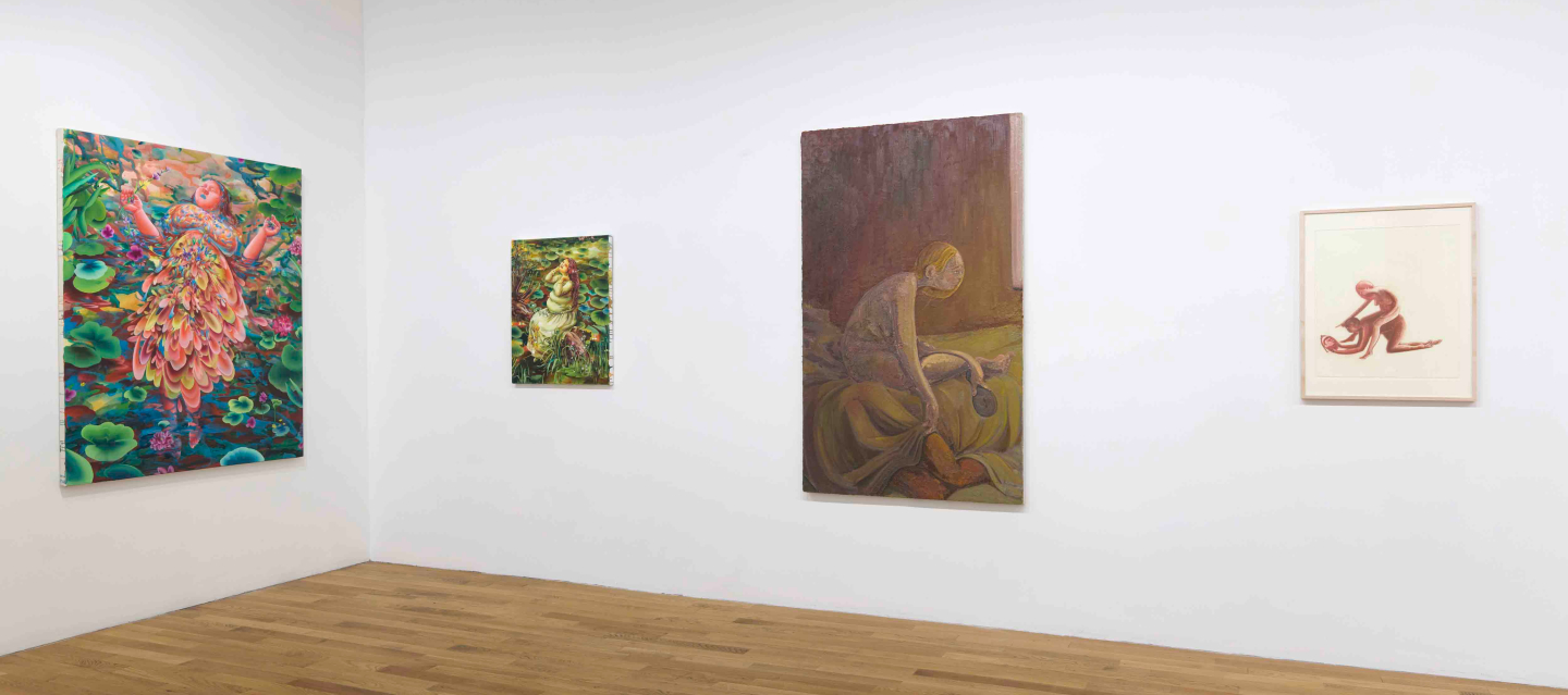 paintings hung on wall of gallery