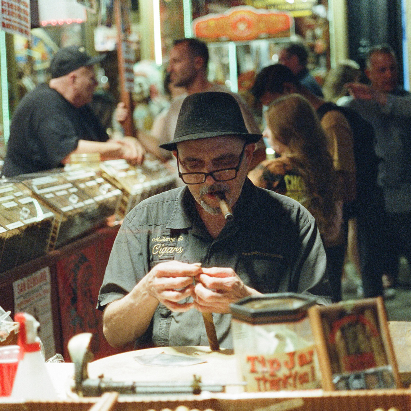 A man smoking a cigar Dimes Sqaure.