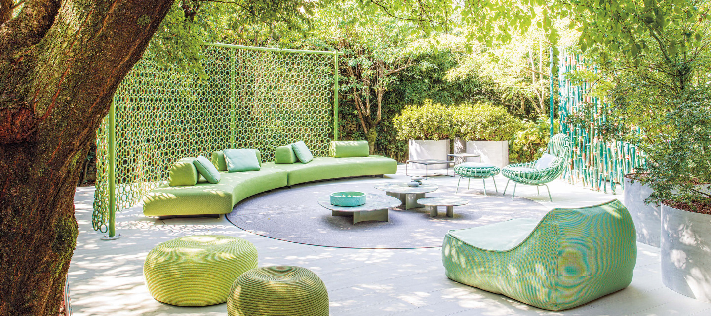outdoor green space with furniture
