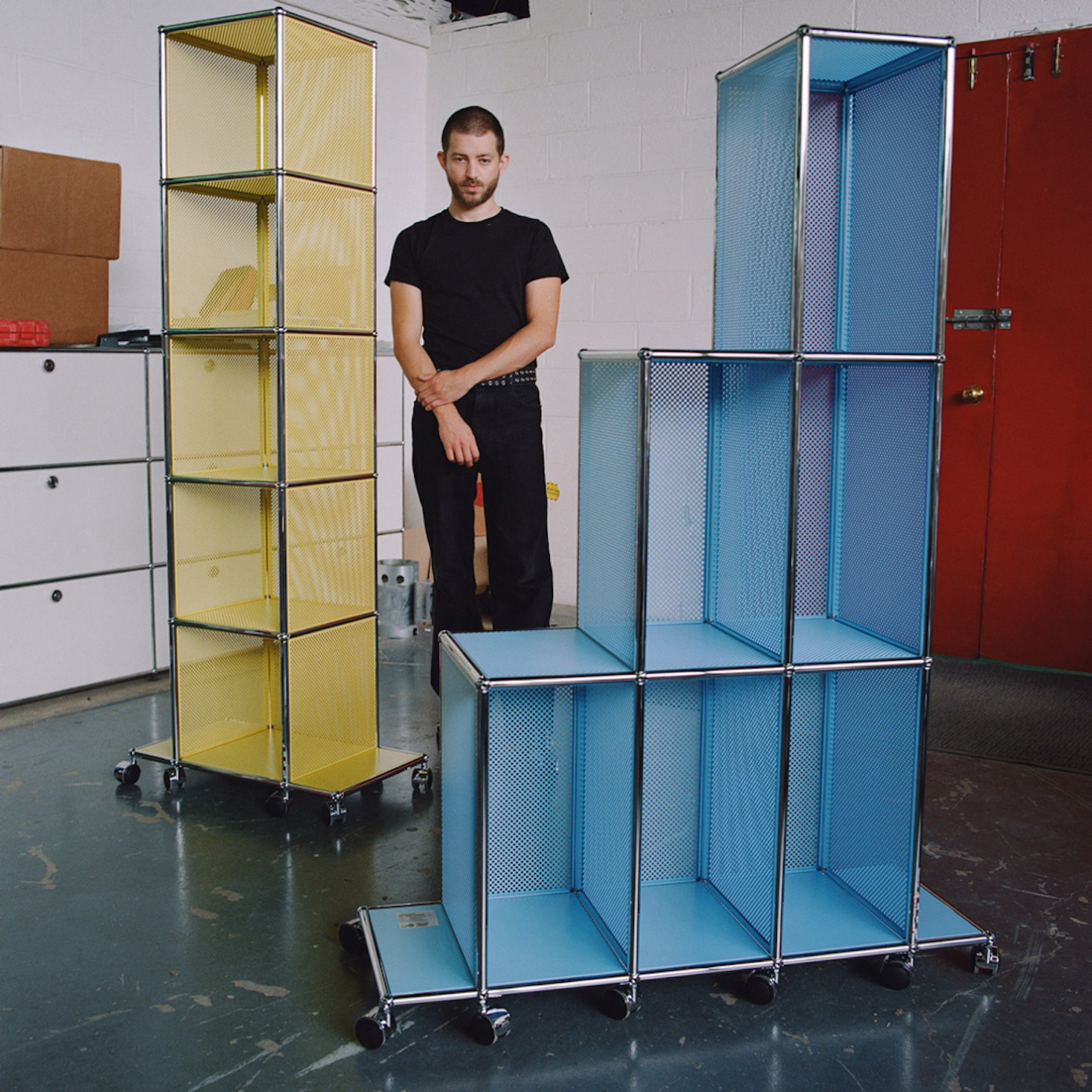 Ben Ganz standing alongside his new collection for USM.