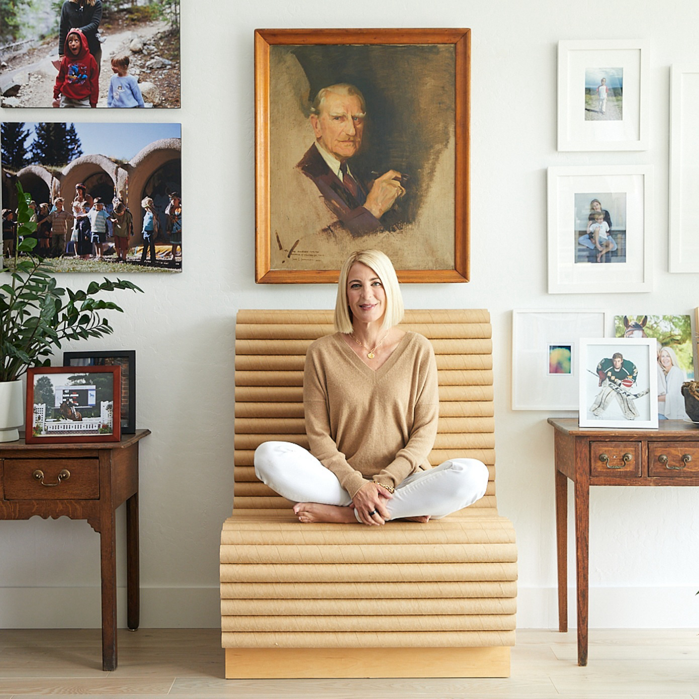 Heidi Zuckerman sitting on a wooden chair.