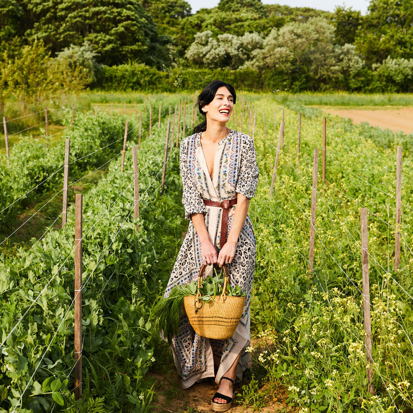 Woman with basket in fields