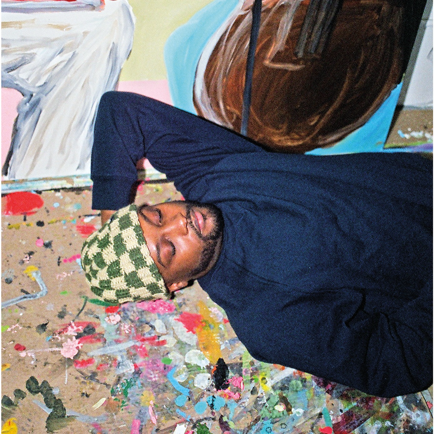 artist on floor of studio