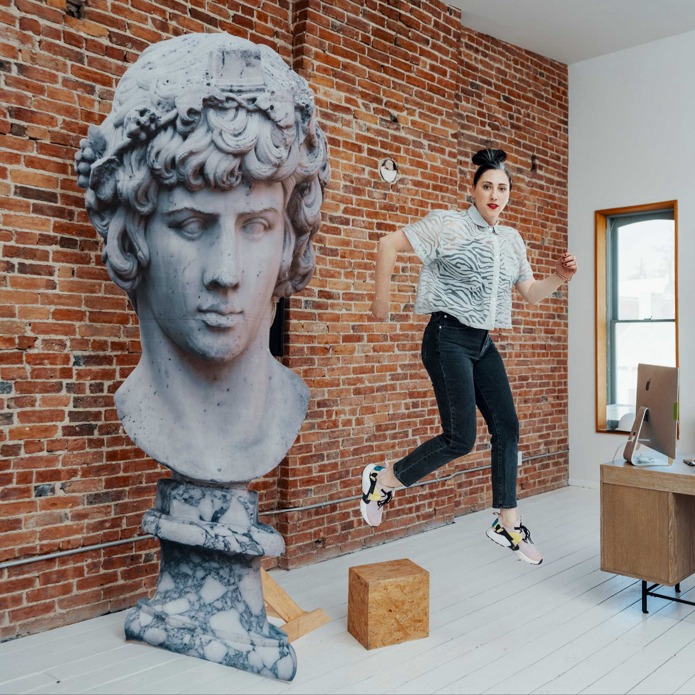 woman jumping in office