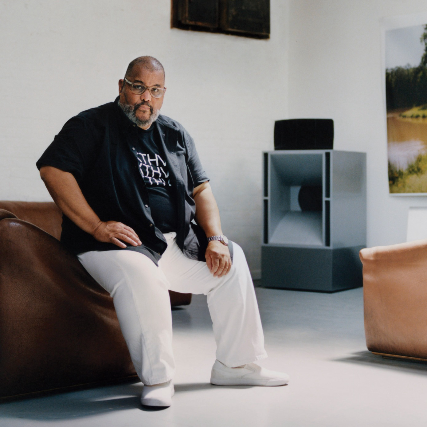 A man sitting in a studio.