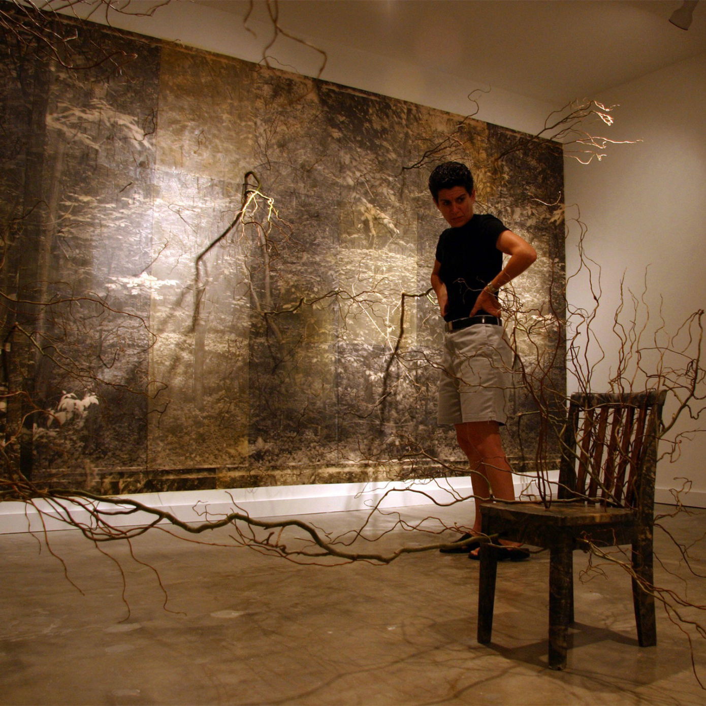 woman with painting and installation