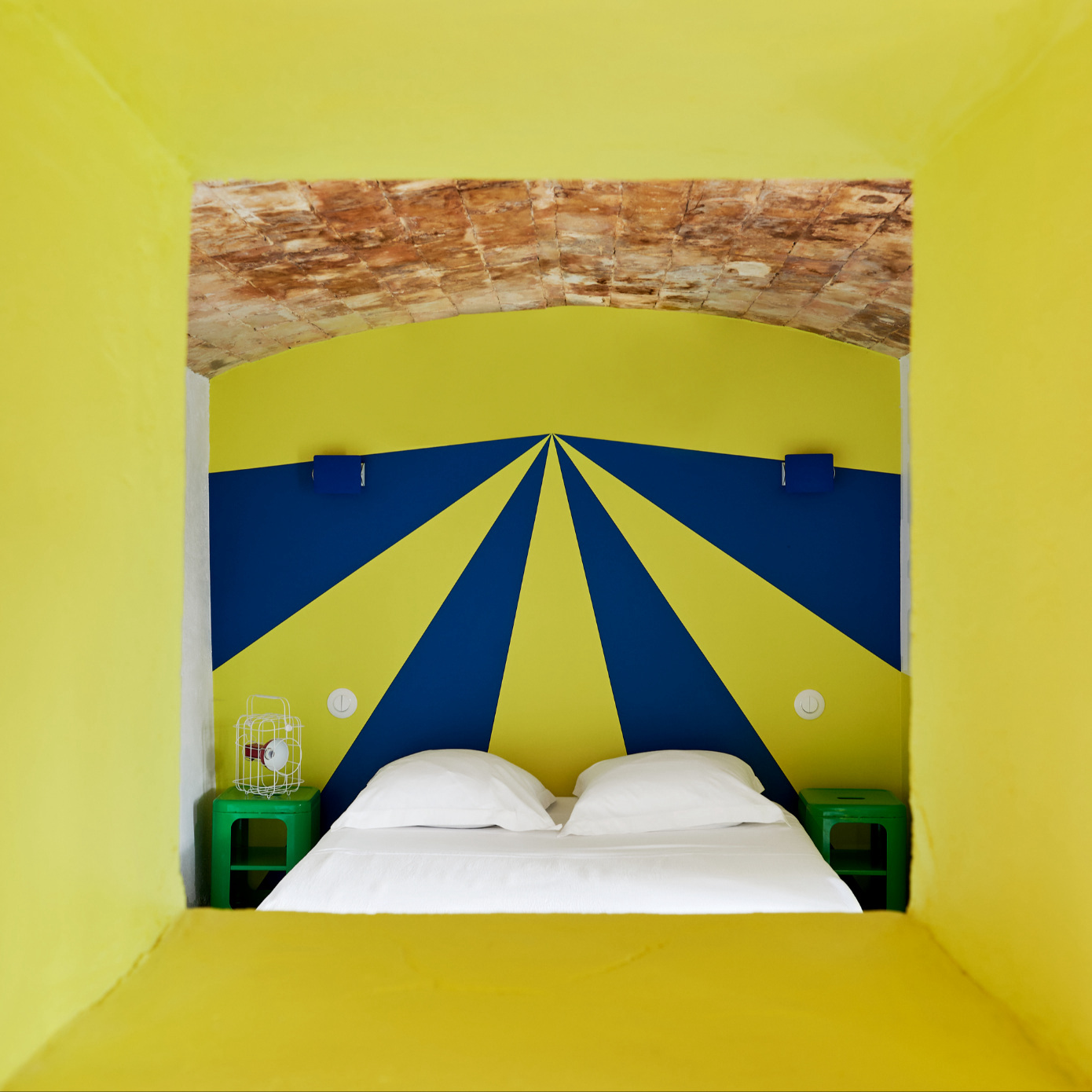 a hotel room with yellow walls