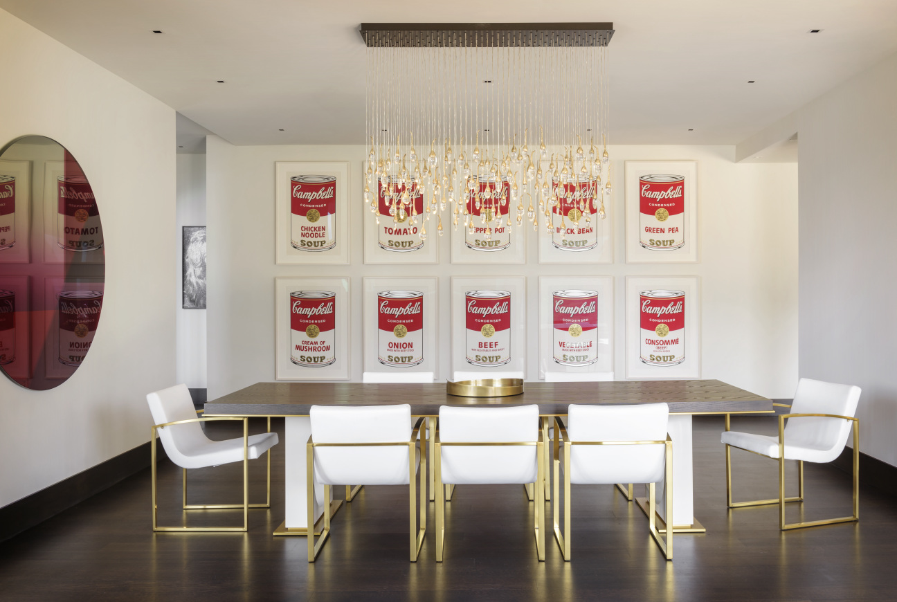 Campbell's soup cans by Andy Warhol, 1962 in a dining room.
