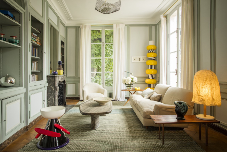 Charles Zana's Paris living room features a Dune table and Djo armchair from his first furniture and lighting collection, launching October 20 and a 1965 Ettore Sottsass totem. Photography by Matthieu Salvaing, courtesy of Charles Zana.