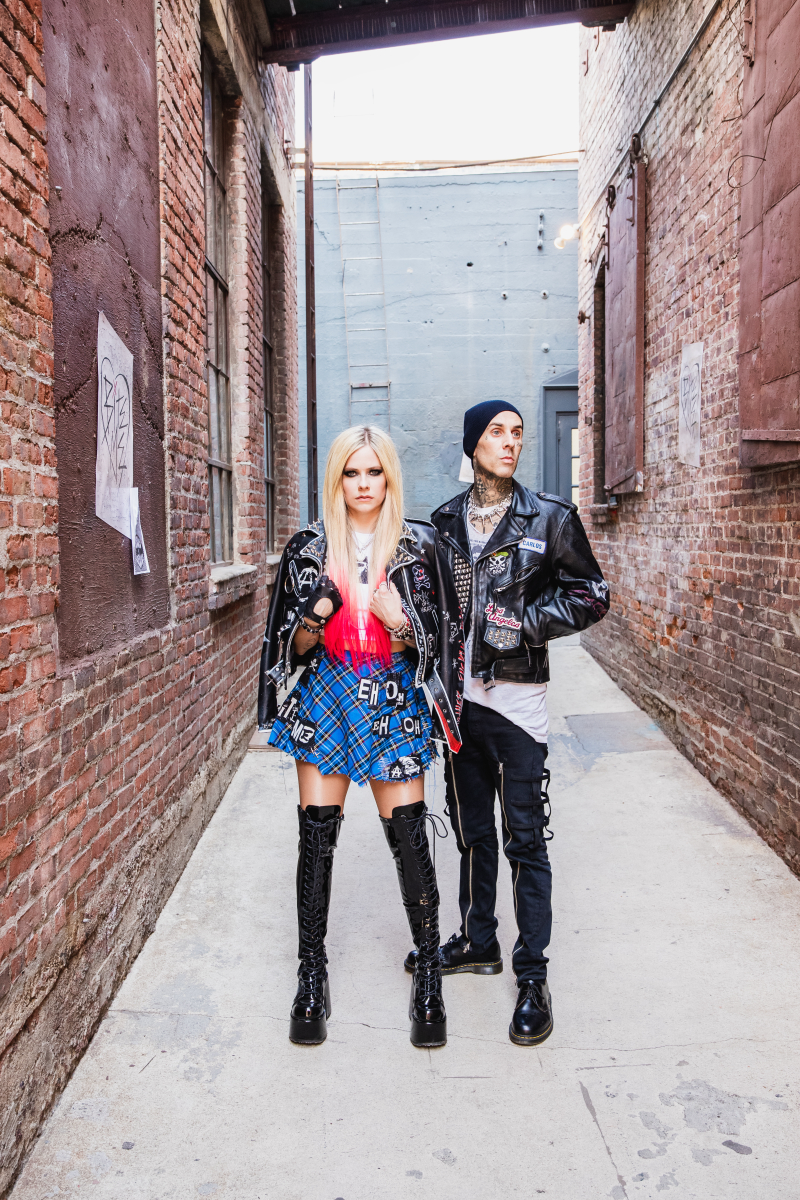 two people standing in alley in punk looks