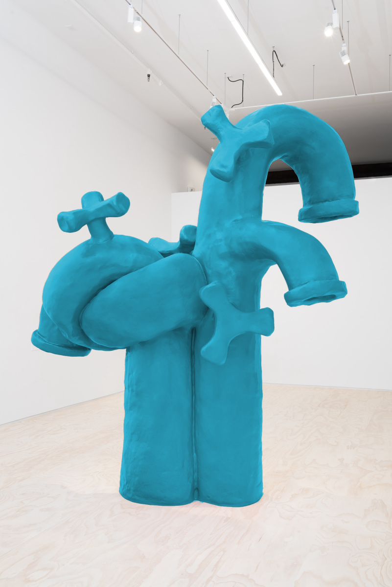 blue sculpture of spigots