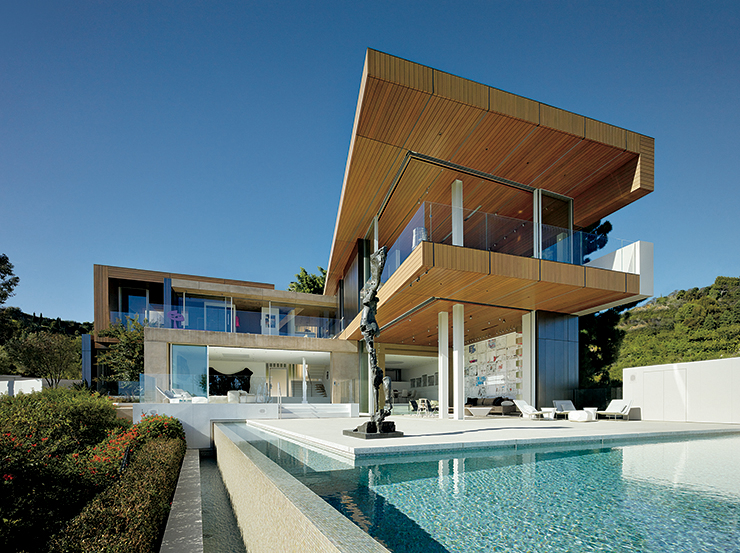 Stephen de Staebler’s Archangel, 1987, overlooks the pool at Schreyer’s Los Angeles home.