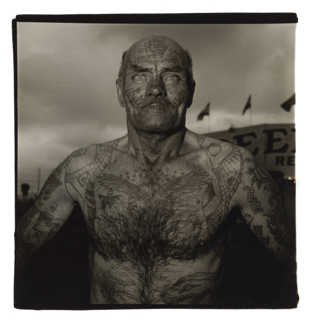 Tattooed man at a carnival, 1970, Diane Arbus, © The Estate Diane Arbus. Courtesy the artist and David Zwirner.