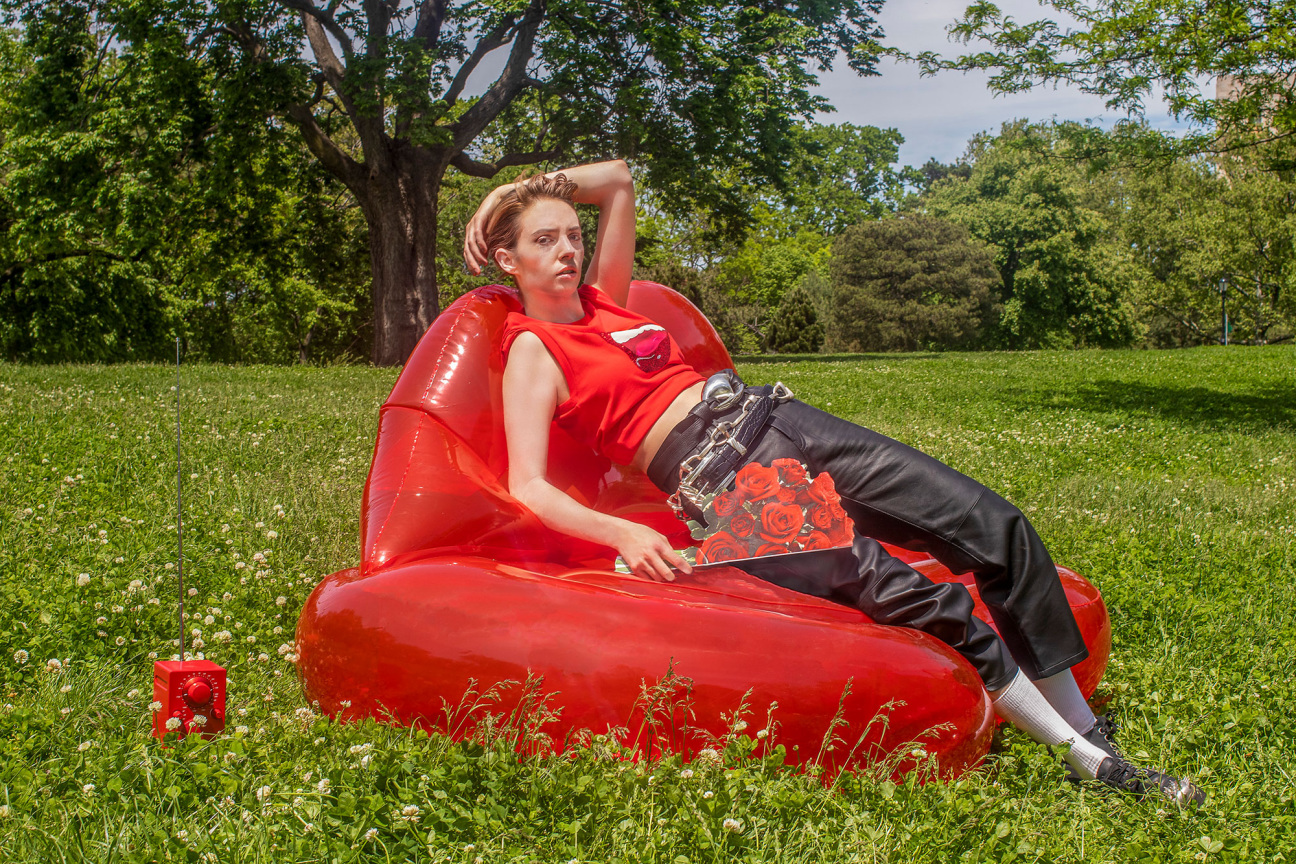 Woman lays on inflatable raft in greener