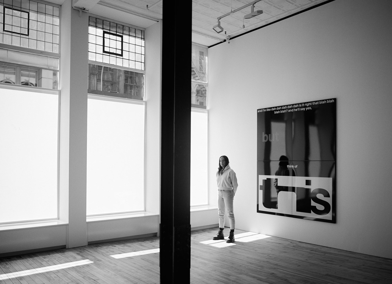 woman standing in gallery