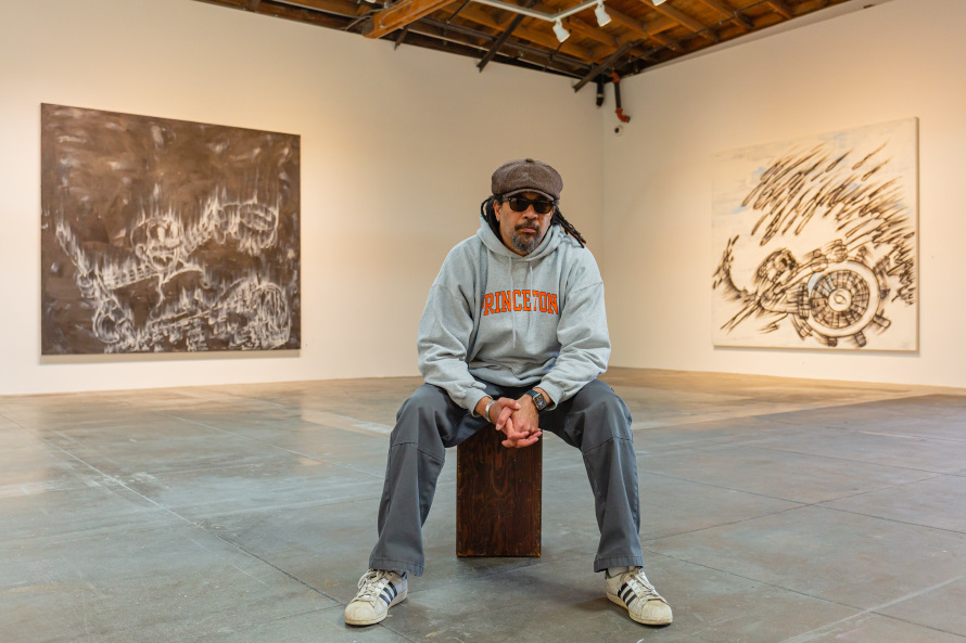 man sitting in gallery