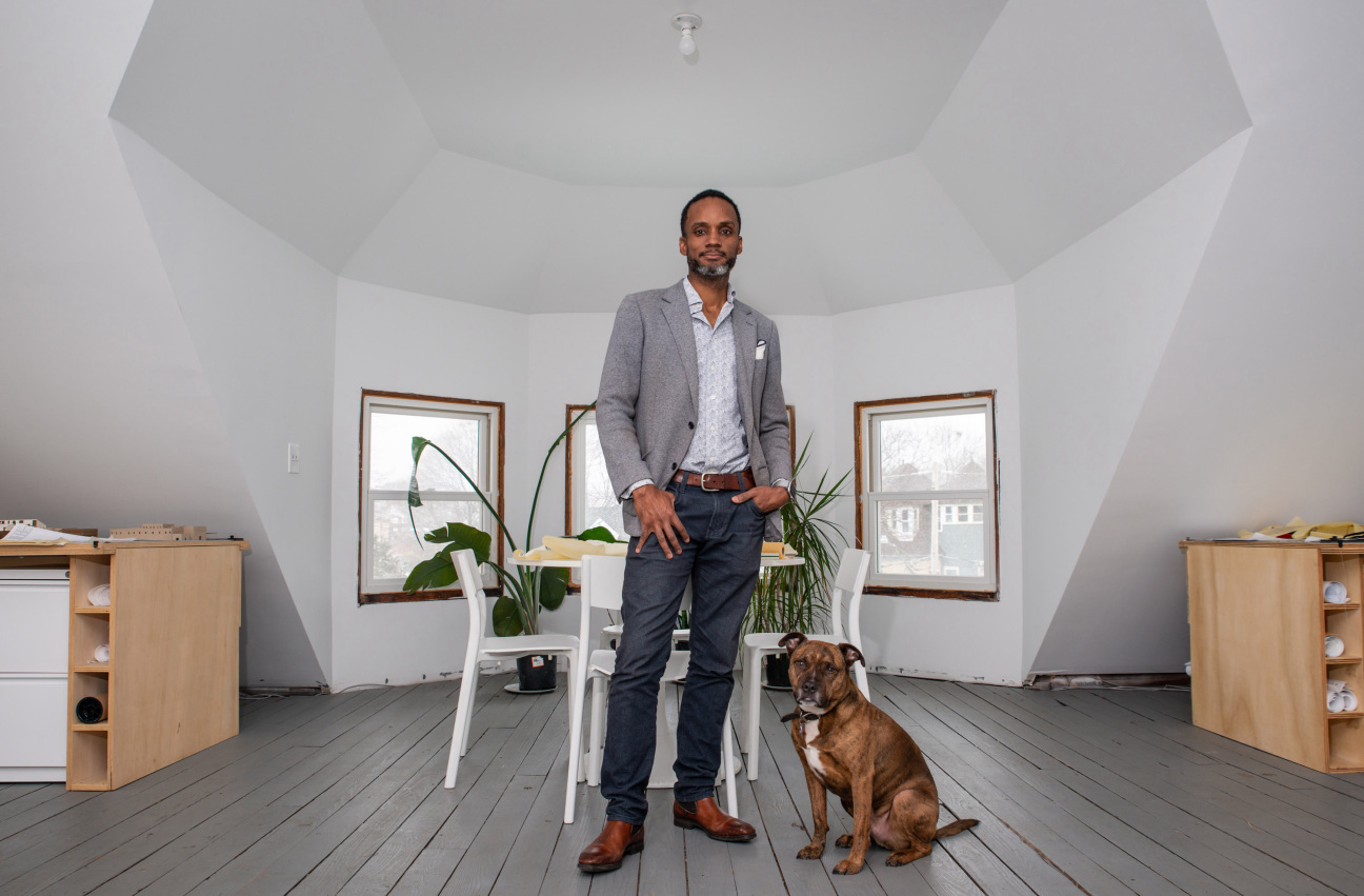 man in office with dog