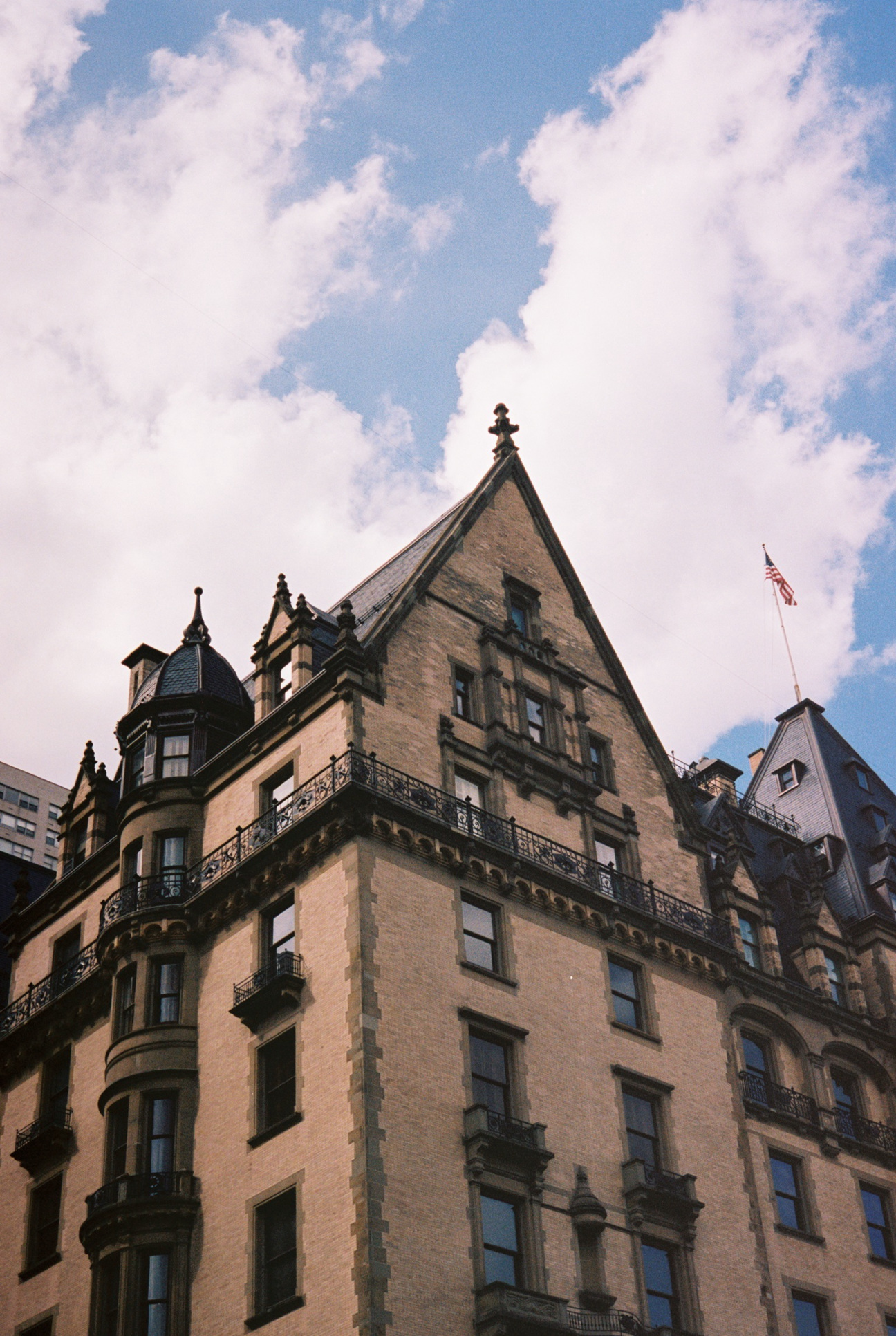 corner of the dakota apartment building with pointed roof and turrets