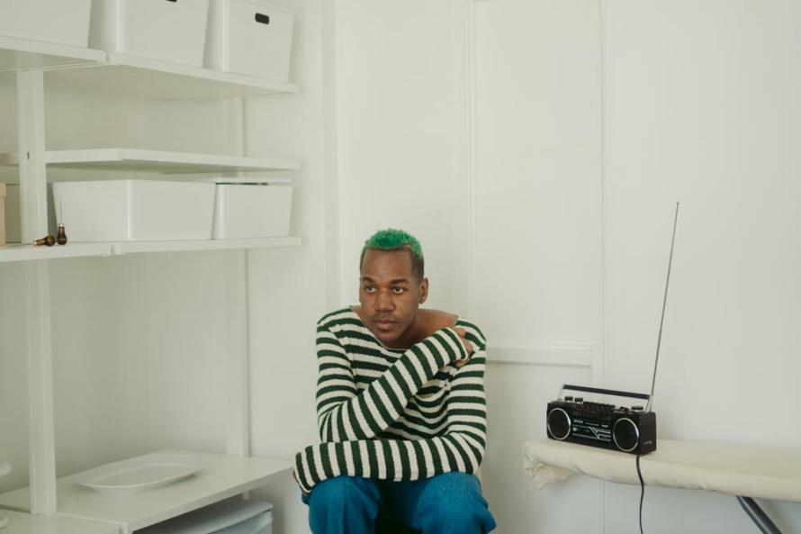 man sitting by radio