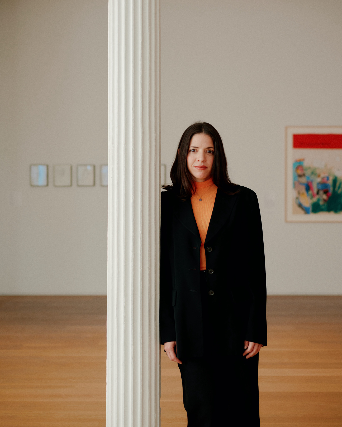 woman standing by column