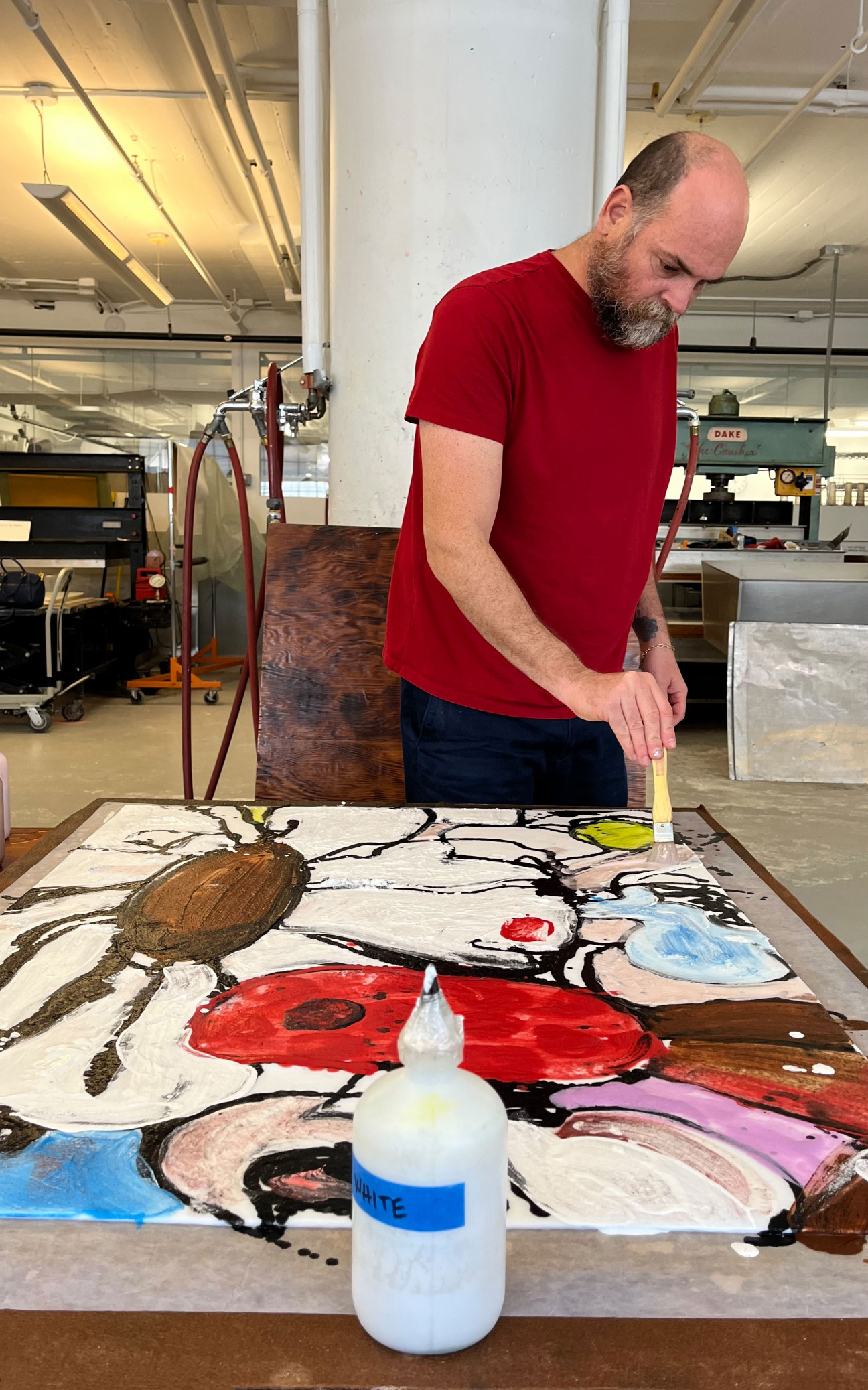 man in studio painting