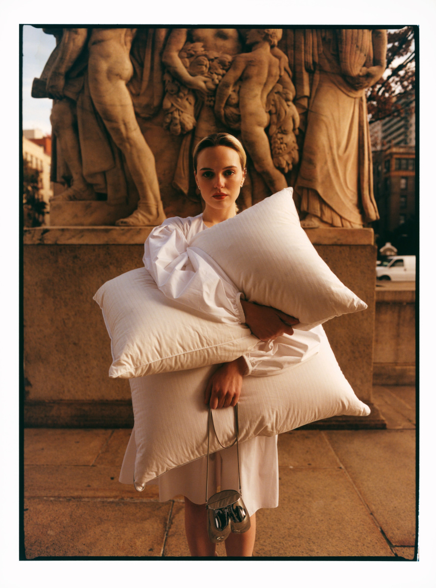 woman holding pillows