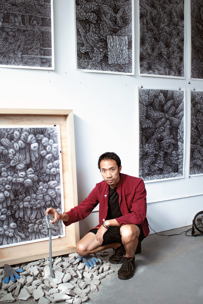 man crouching in studio